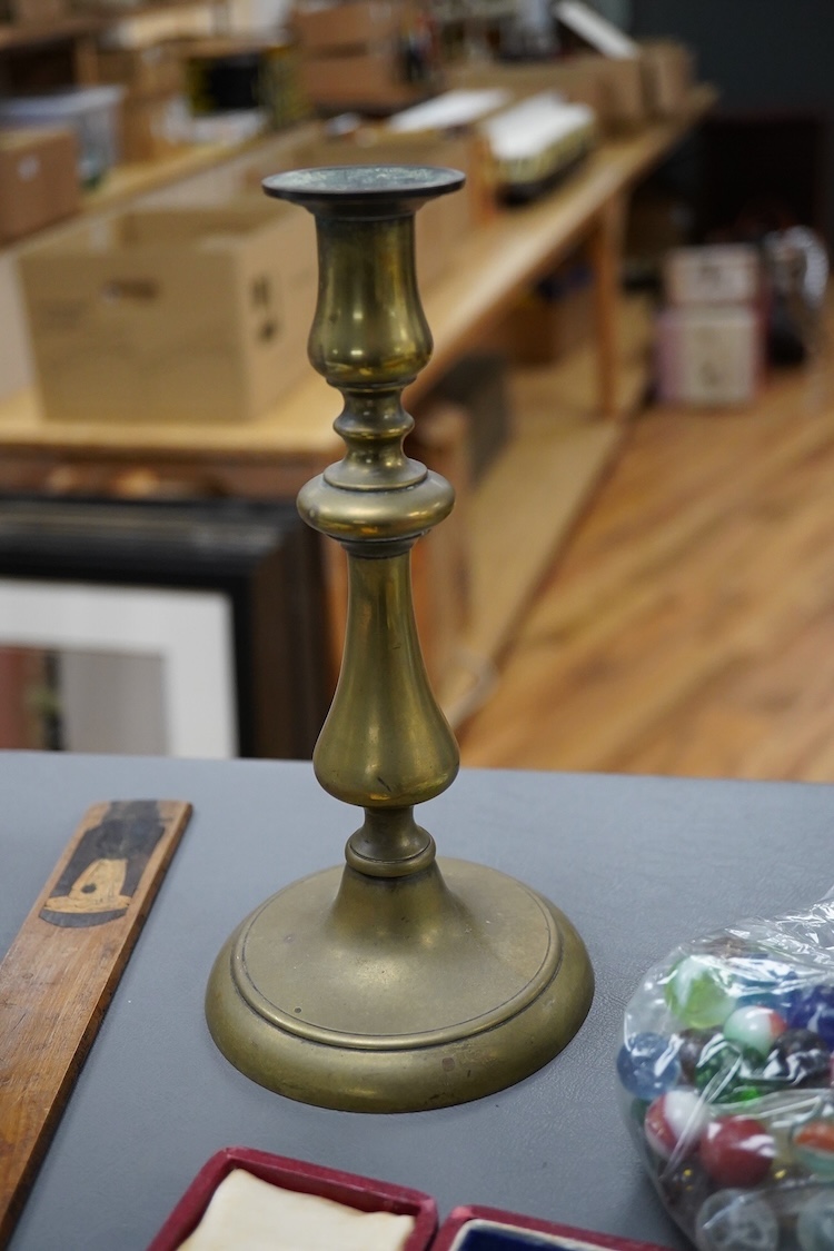 Sundry items to include a silver commemorative spoon, collection of marbles, brass candlestick and a souvenir treen ruler